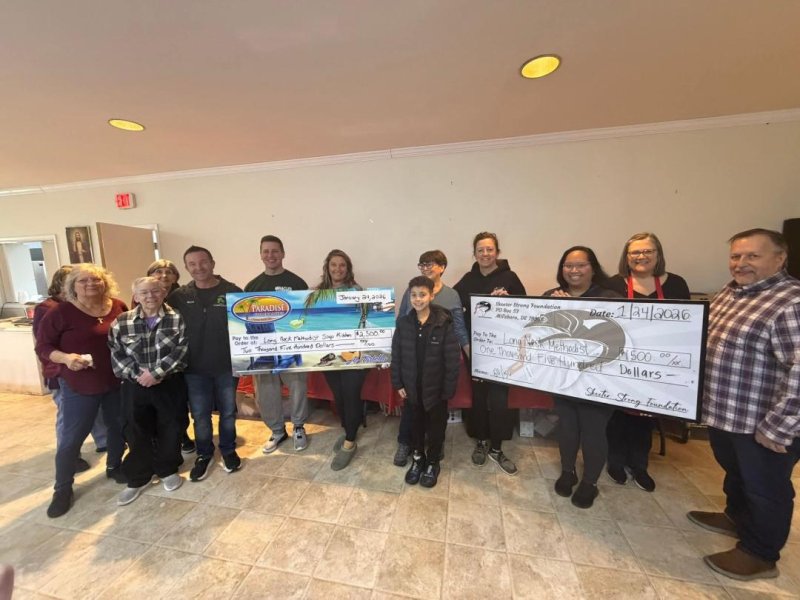 Check presentation attendees are (l-r) Debbie Mazyck, Diana Dietz and Teri Lowenger, soup kitchen volunteers; Bryan Sears, Paradise Companies director of operations; Shane Knick, soup kitchen volunteer; Anna Gravett, Paradise Companies marketing director; Kasche Maddox and Robin Brown, soup kitchen volunteers; BA Racine-Kerezsi, Skeeter Strong Foundation and Paradise Companies events director; Britanie Farren, Skeeter Strong Foundation member; Doreen Mattingly, soup kitchen volunteer; and Pastor Daniel Myers, Long Neck Methodist Church. SUBMITTED PHOTOS